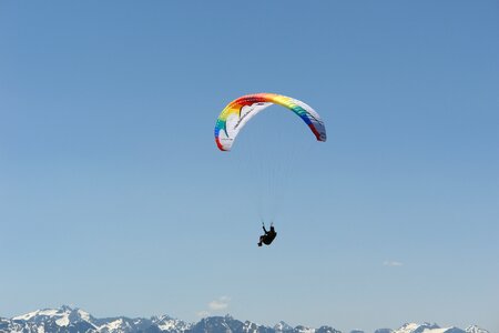 Paraglider mountains sky