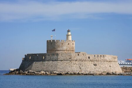 Lighthouse flag sea