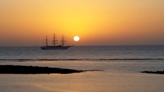 Sea sailboat sun photo