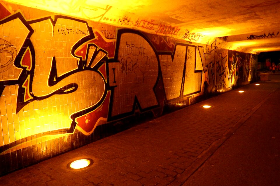 Night street subway graffiti on the wall photo