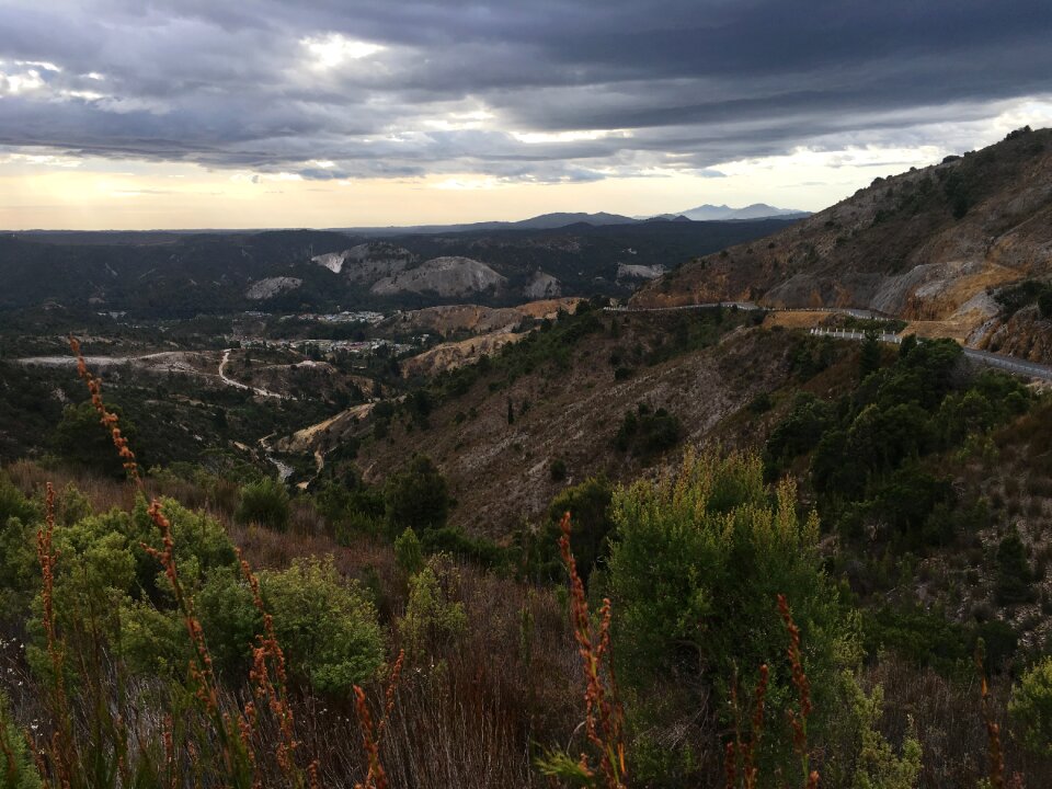 Mountain drive distant town overcast