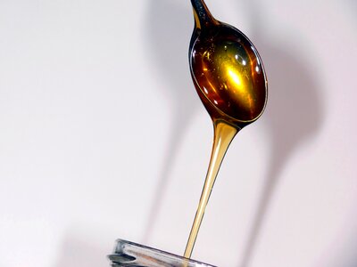 Yellow honeyed honey jar photo