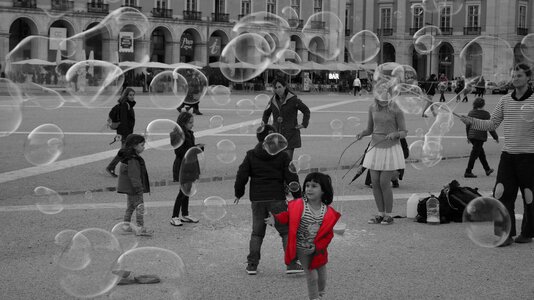 Child bubbles downtown photo