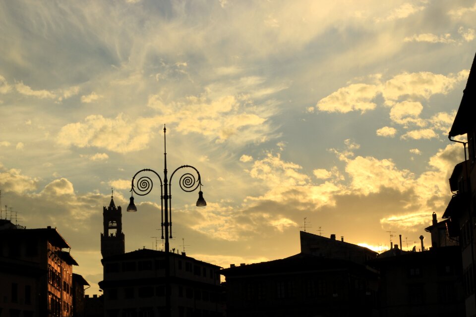 Street lamp tower clouds