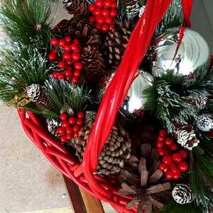 Decorating red basket ornaments
