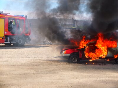 Car on fire flame red