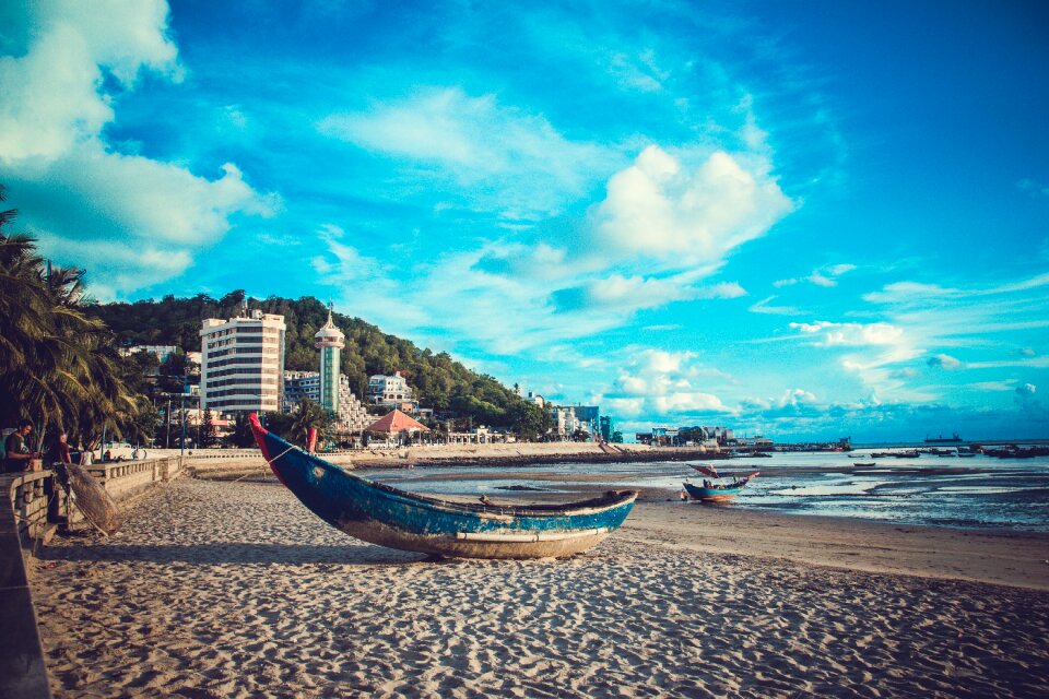 Fishing boat blue sky sand