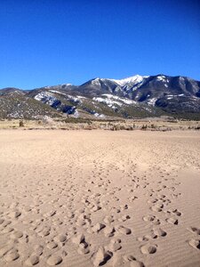 Mountains sand footsteps photo