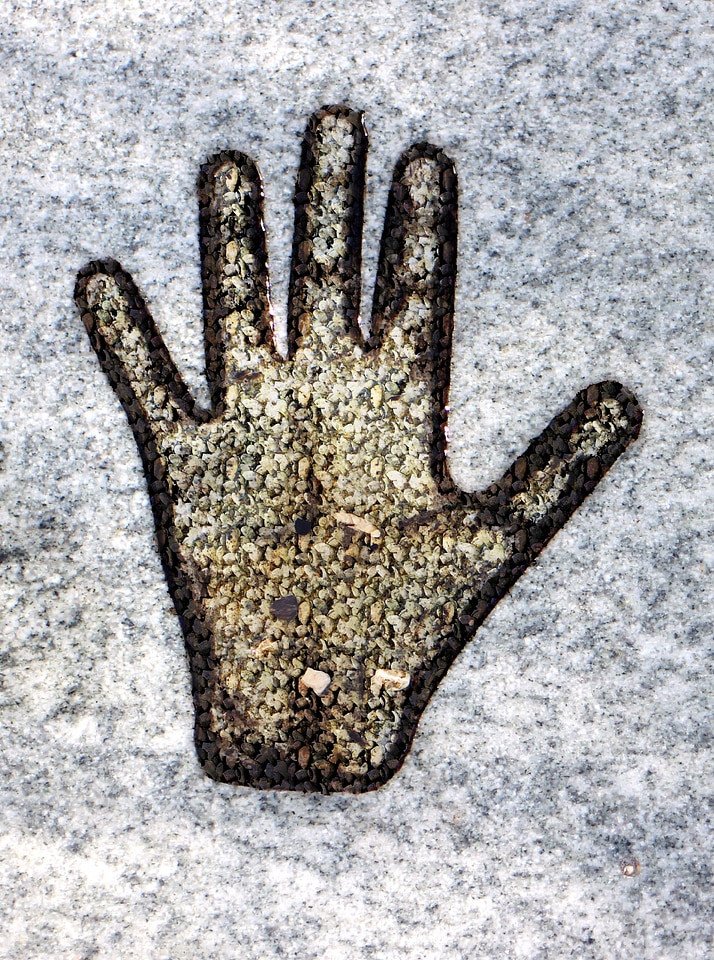 Stone hand symbol art