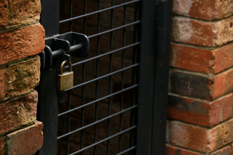 Padlock cage brick photo