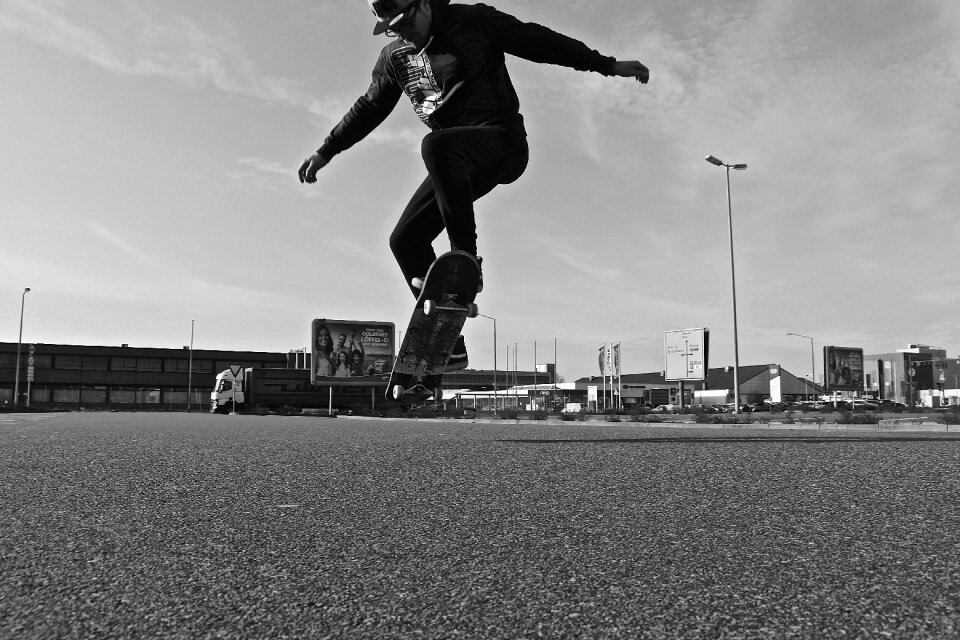 Skateboard tricks young man
