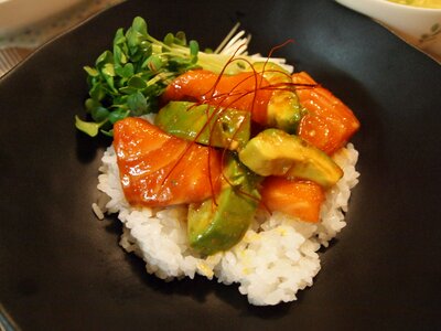 Cuisine cooking avocado and salmon rice