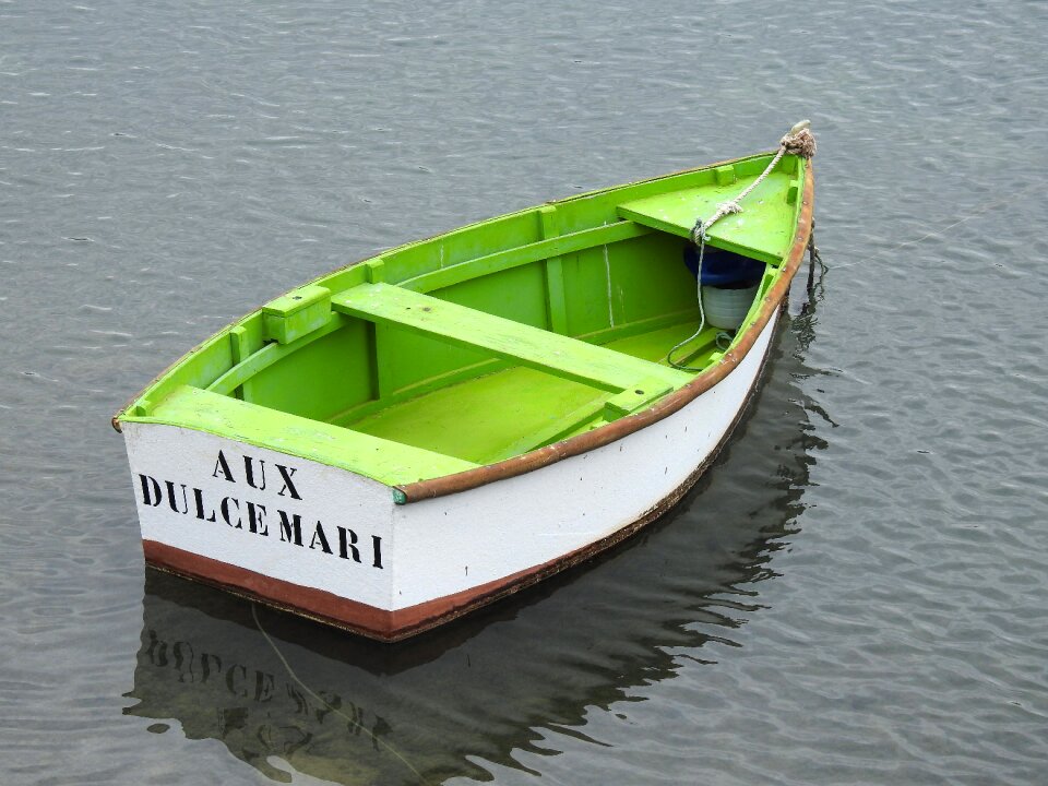 Fisherman rowing boat wooden boat photo