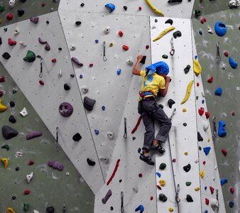 Artificial climbing wall climbing holds climber photo