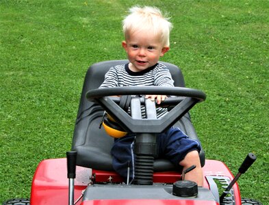 Machine mowing children photo