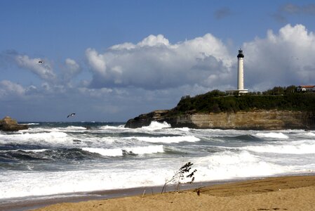 Lighthouse sea waves photo