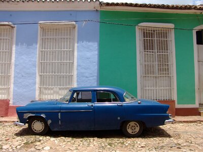 Blue classic car old house