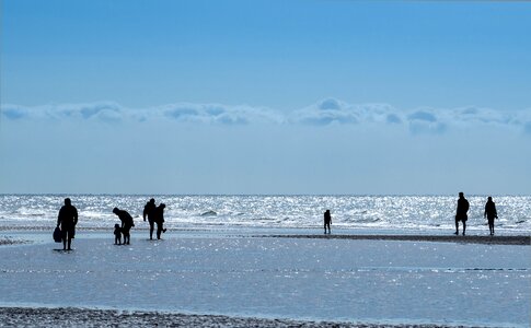 Human by the sea clouds photo