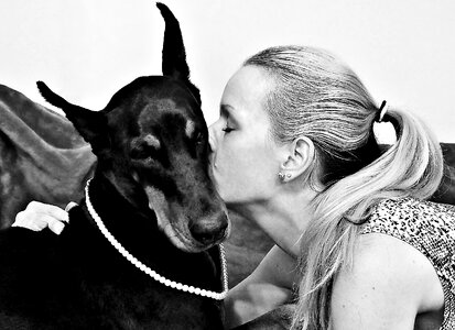 Doberman blonde woman hug