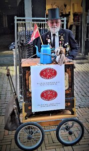 Pedestrian zone old barrel organ collect for a good cause