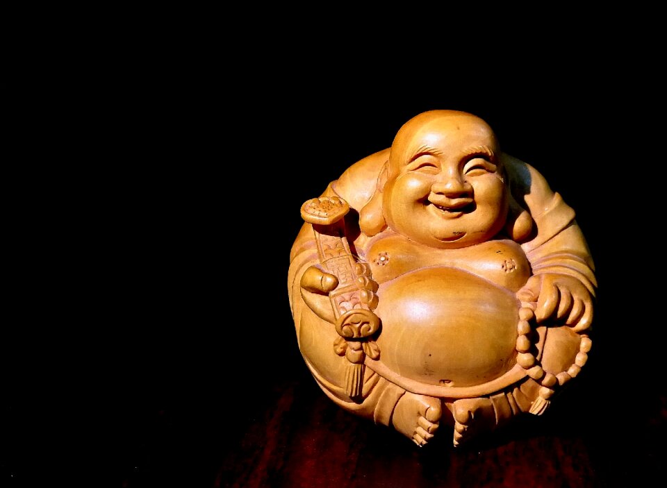 Maitreya wood carving happy
