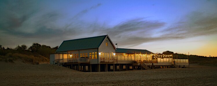 Cafe by the sea beach house dunes sunset on the sea