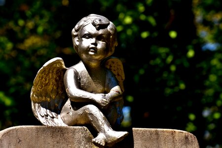 Guardian angel pray sculpture photo