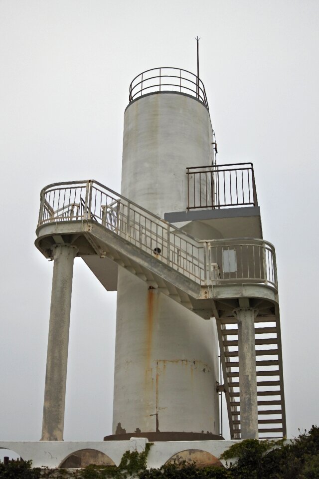Lighthouse coast partly cloudy
