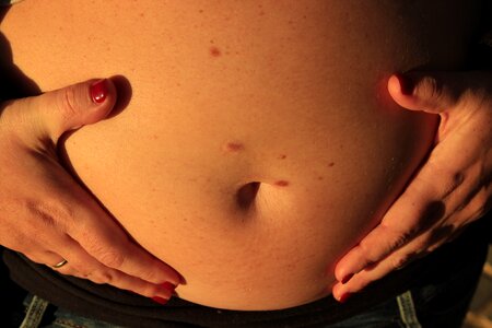 Mama belly button prenatal photo