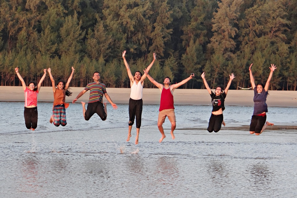 Happy people beach frolic