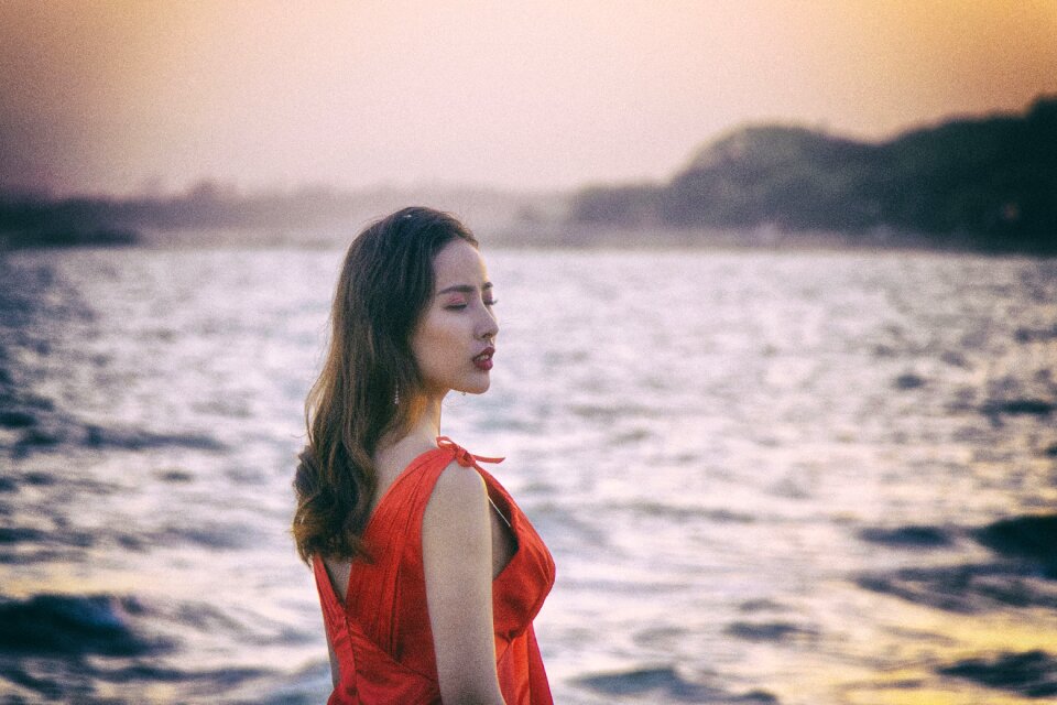 Long hair red corset beach