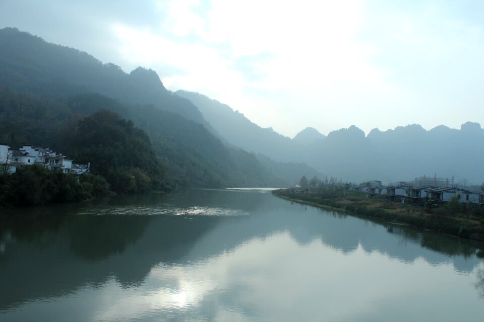 River distant hills reflection