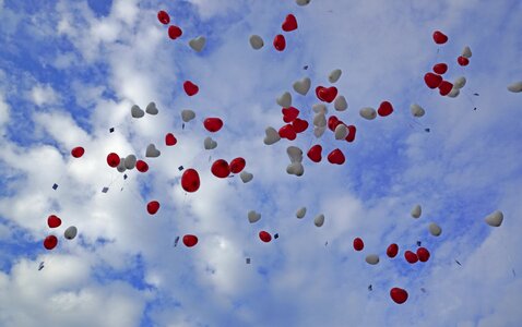 Sky red balloons blue