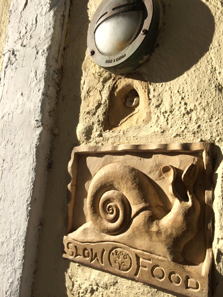 Carved stone relief snails
