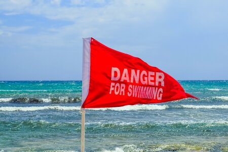 Rough sea caution beach
