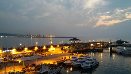 Ferry terminal at dusk fisherman's bastion in hong kong photo
