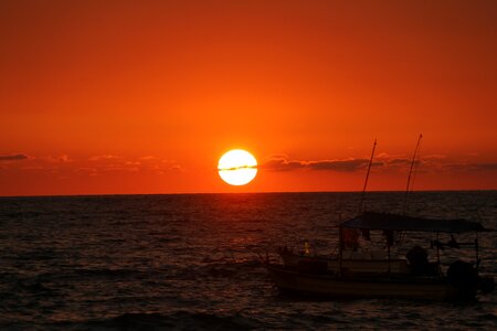 Fishing boat beach beach sunset photo