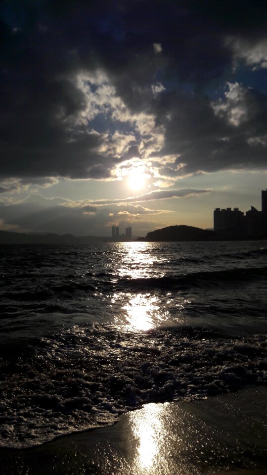 Cloud thunder lightning light intense sun beach sea sun clouds
