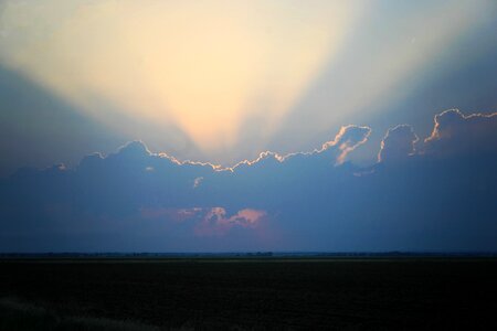 Storm sky clouds sun rays photo