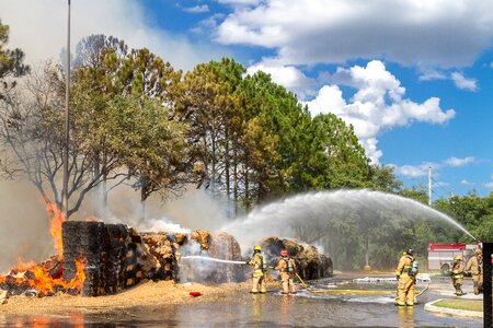 Firefighters fire hose tractor supply