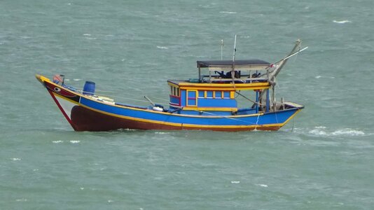 Blue fishing boat photo