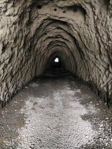 Dark tunnel rock photo