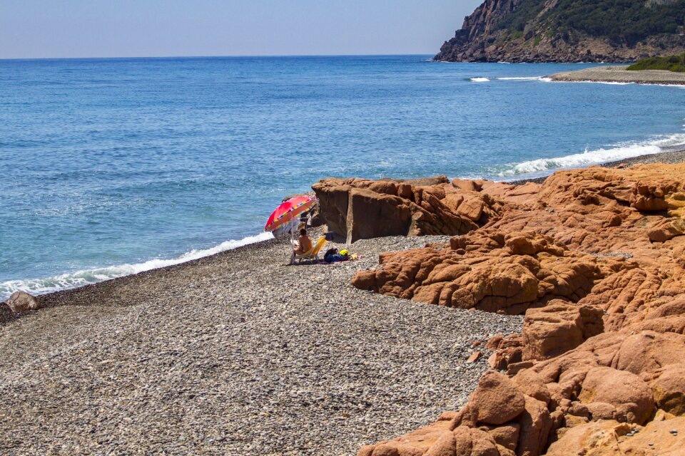 Lonely beach sardinia parasol photo