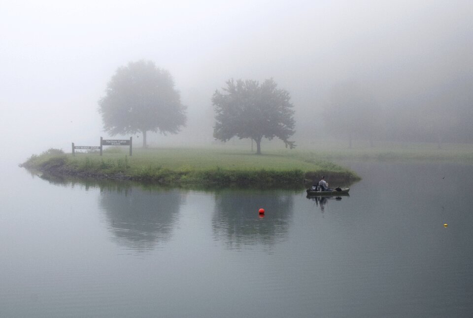 Fog fisherman boat