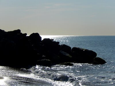 Rocks in the edge of the sea calm photo