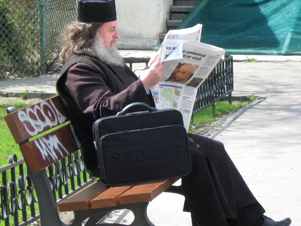 Sitting newspaper old man