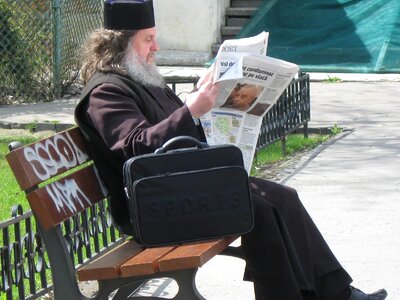 Sitting newspaper old man photo