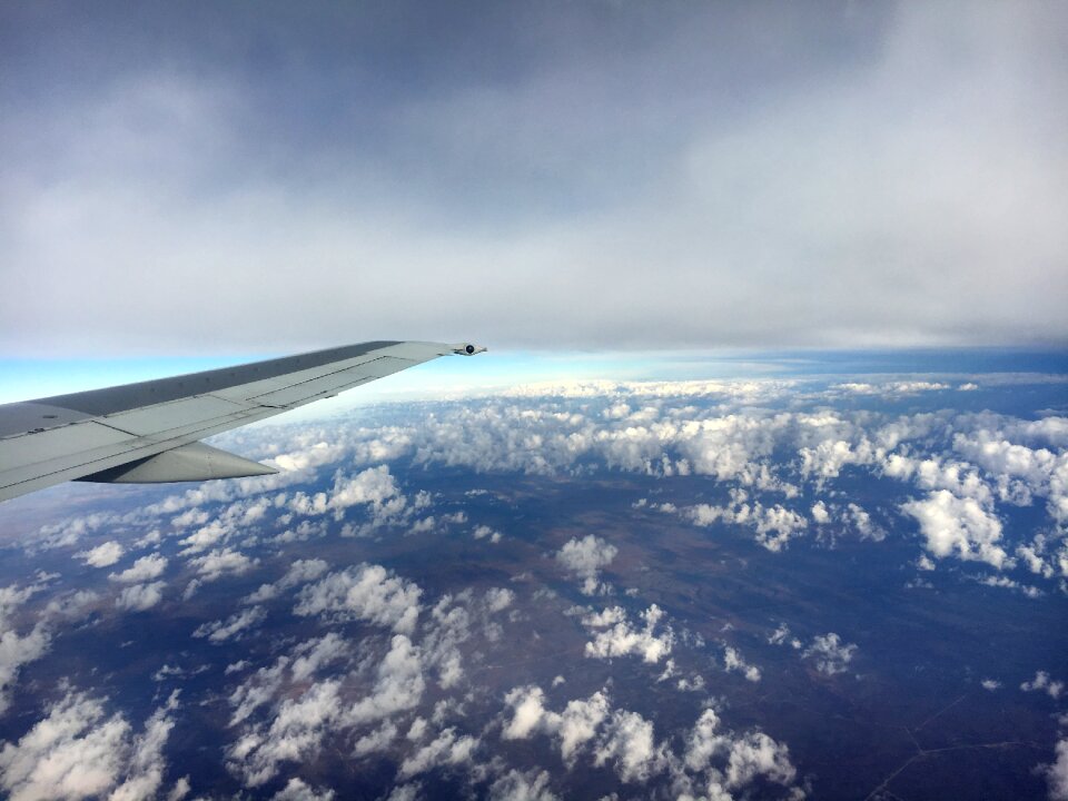 Clouds flying plane