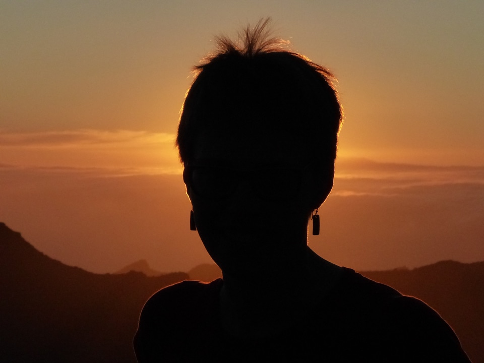 Person backlighting woman