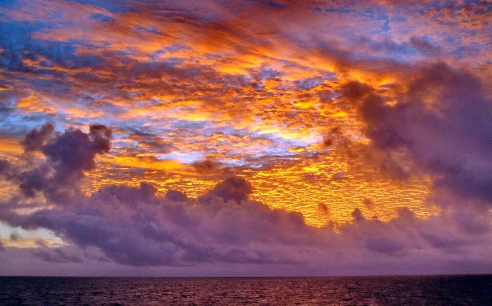 Sea sun clouds photo